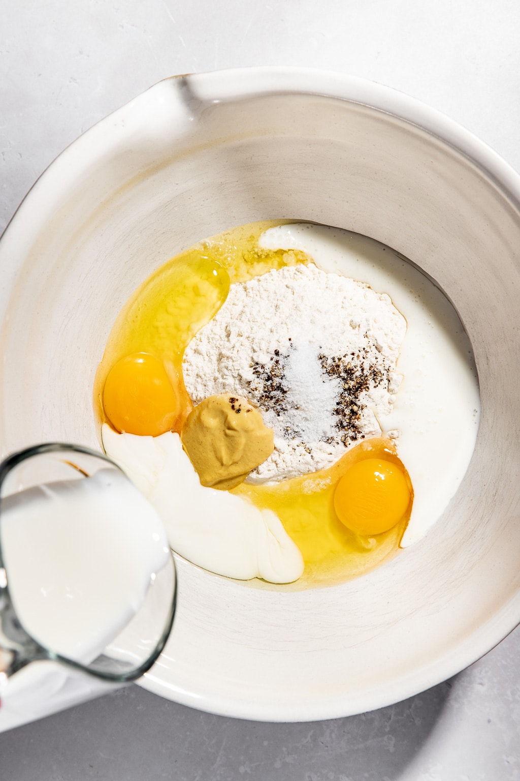 spaetzle batter ingredients in a mixing bowl