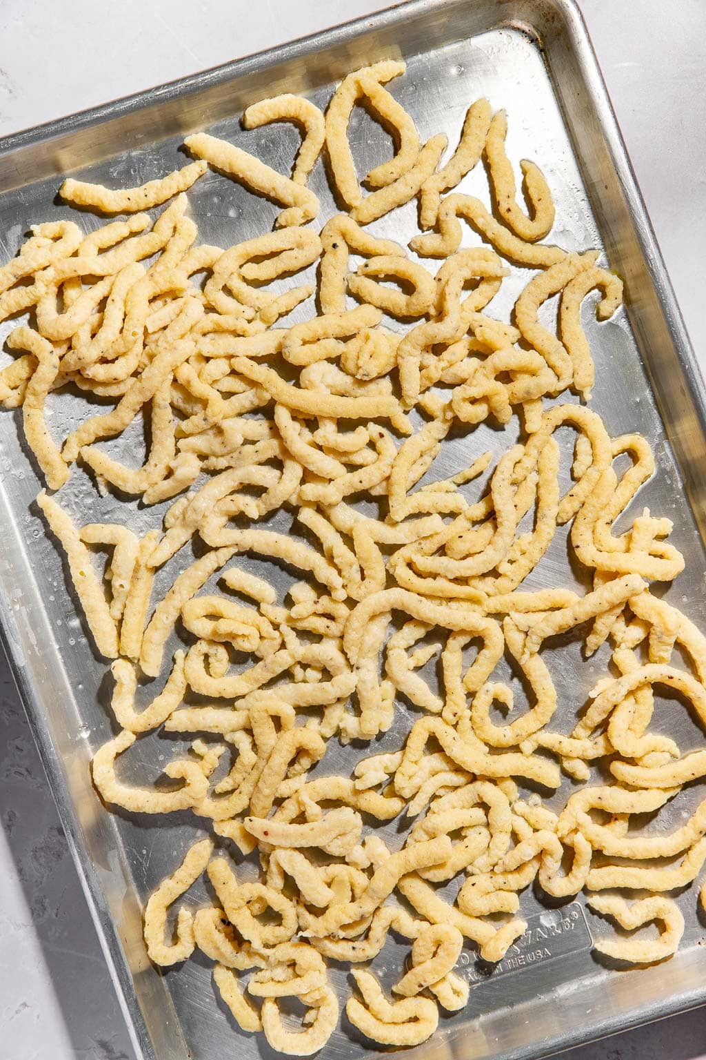 spaetzle after boiling on a sheet tray