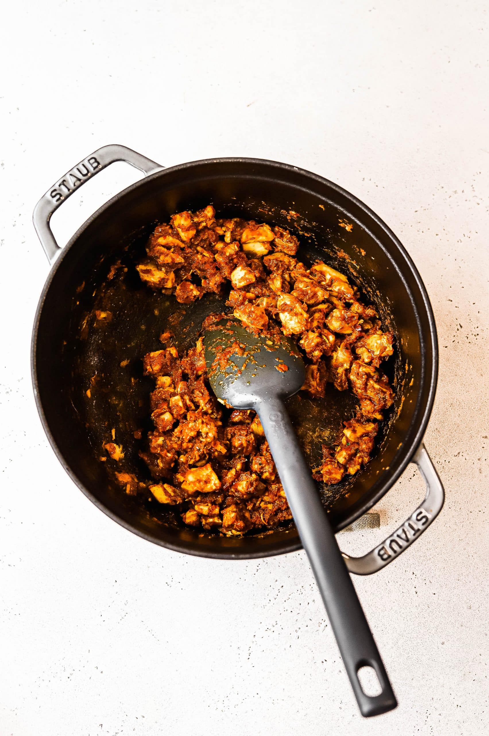 chicken and curry paste cooking