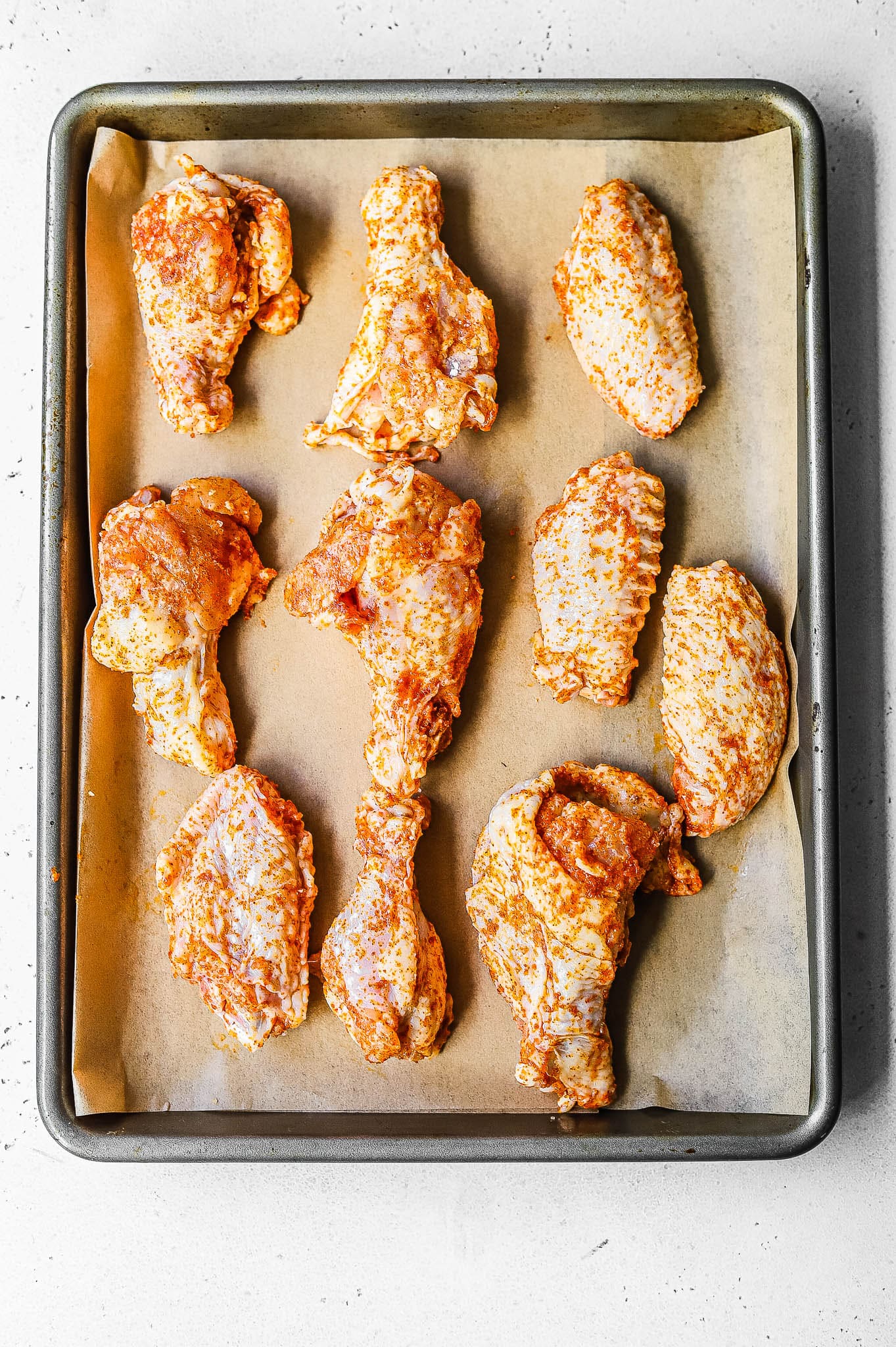 wings on a baking tray before baking
