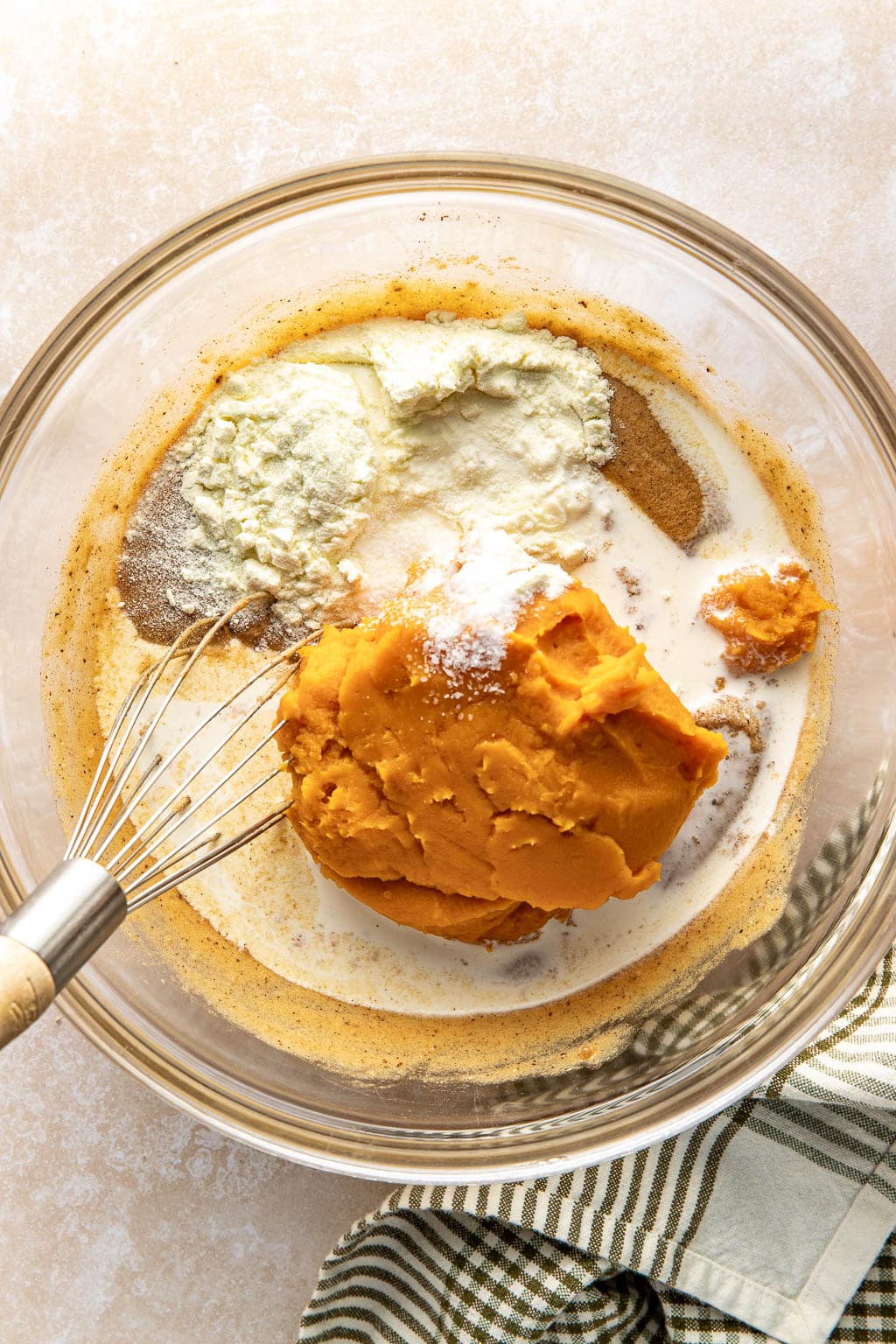 Sweet potato pie filling ingredients in a mixing bowl. 