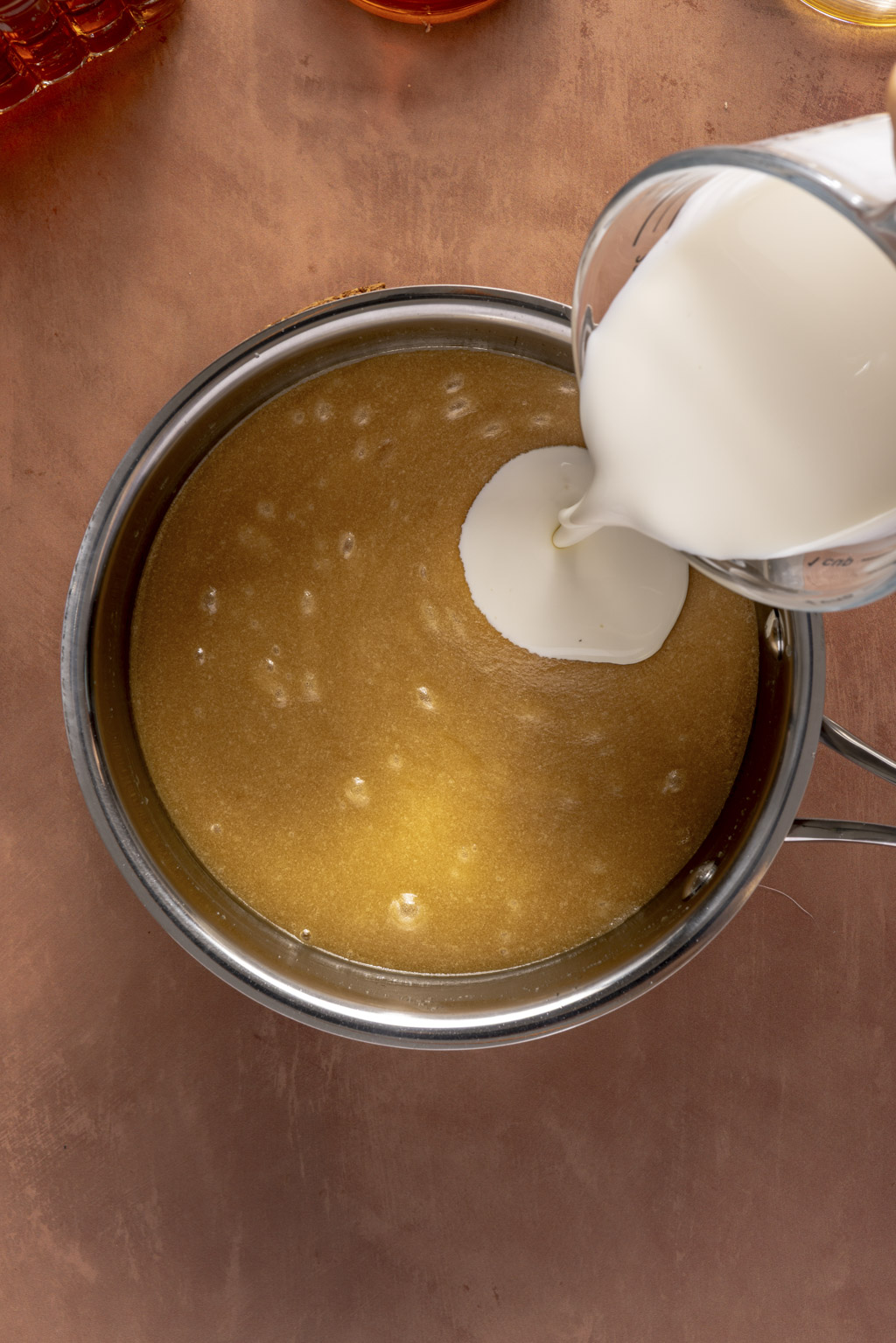 adding cream to the brown sugar and butter mixture
