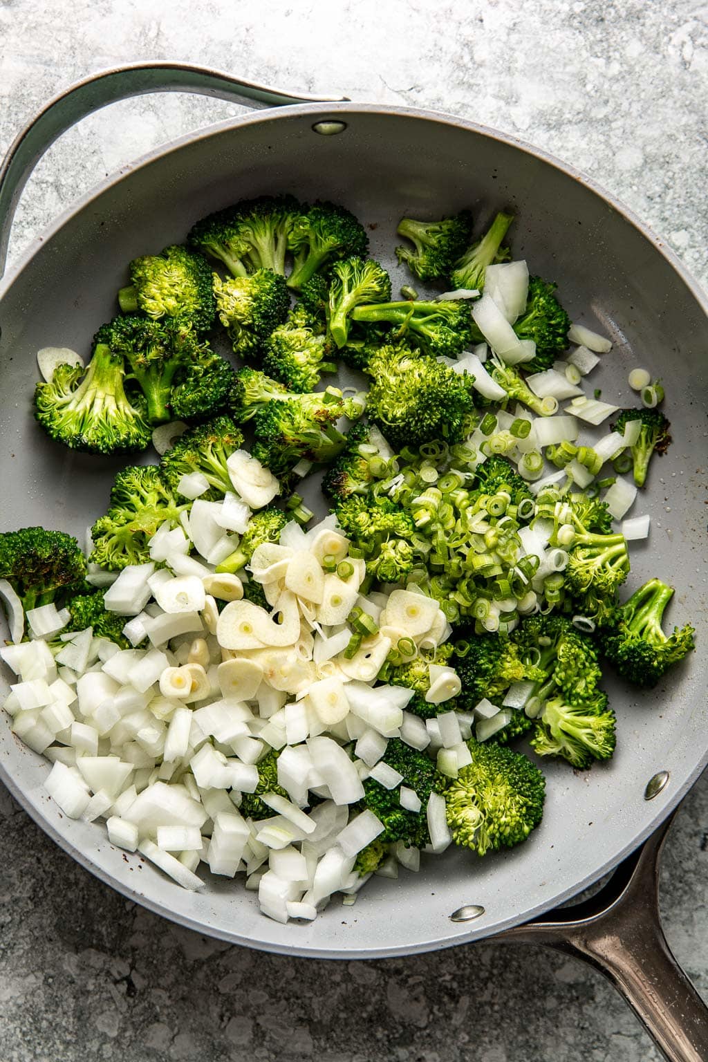 Broccoli, onion, and garlic in a skillet