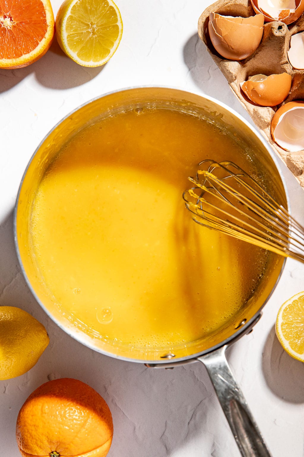 citrus curd while cooking in a saucepan