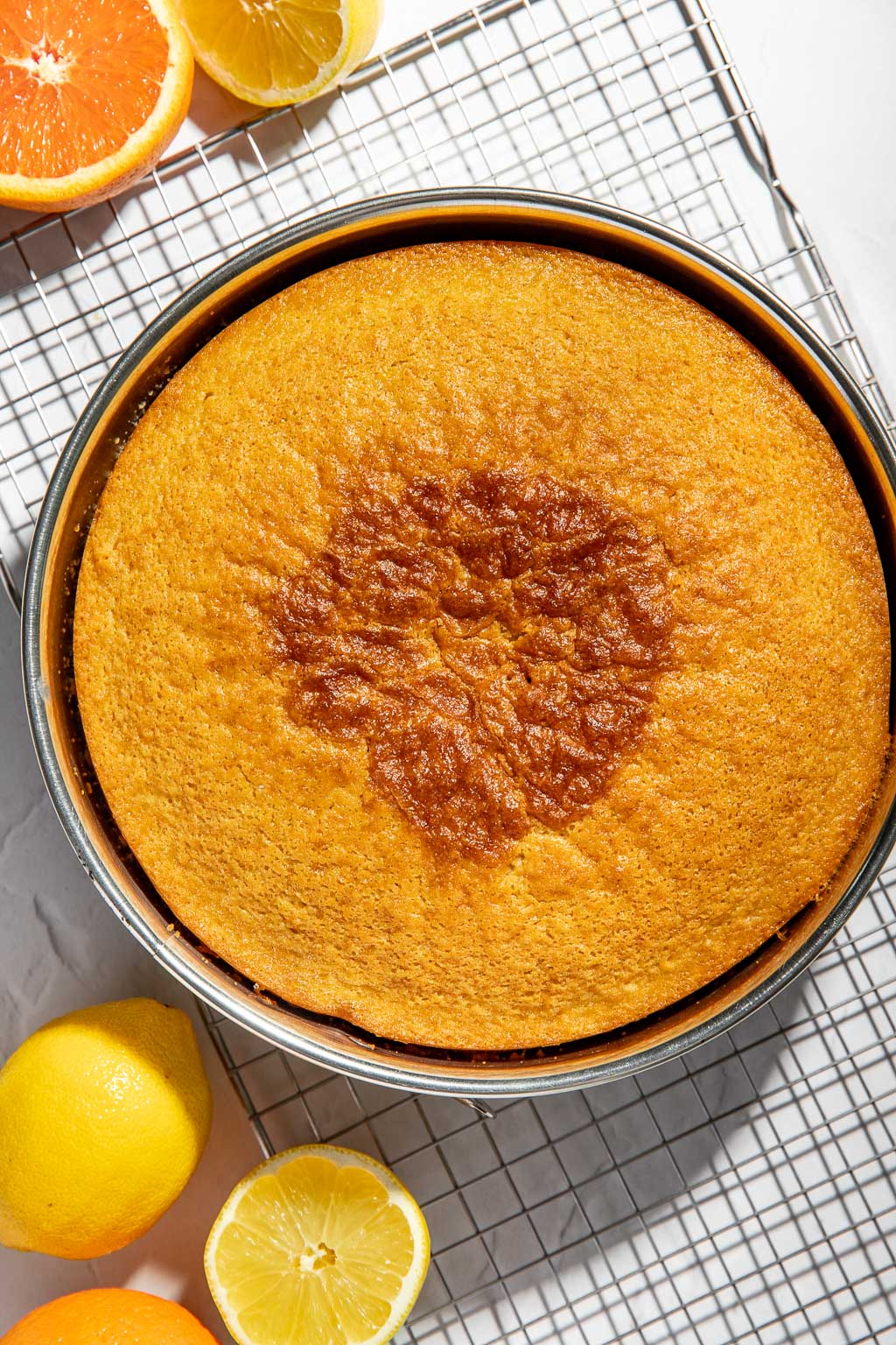 olive oil cake on a cooling rack after baking