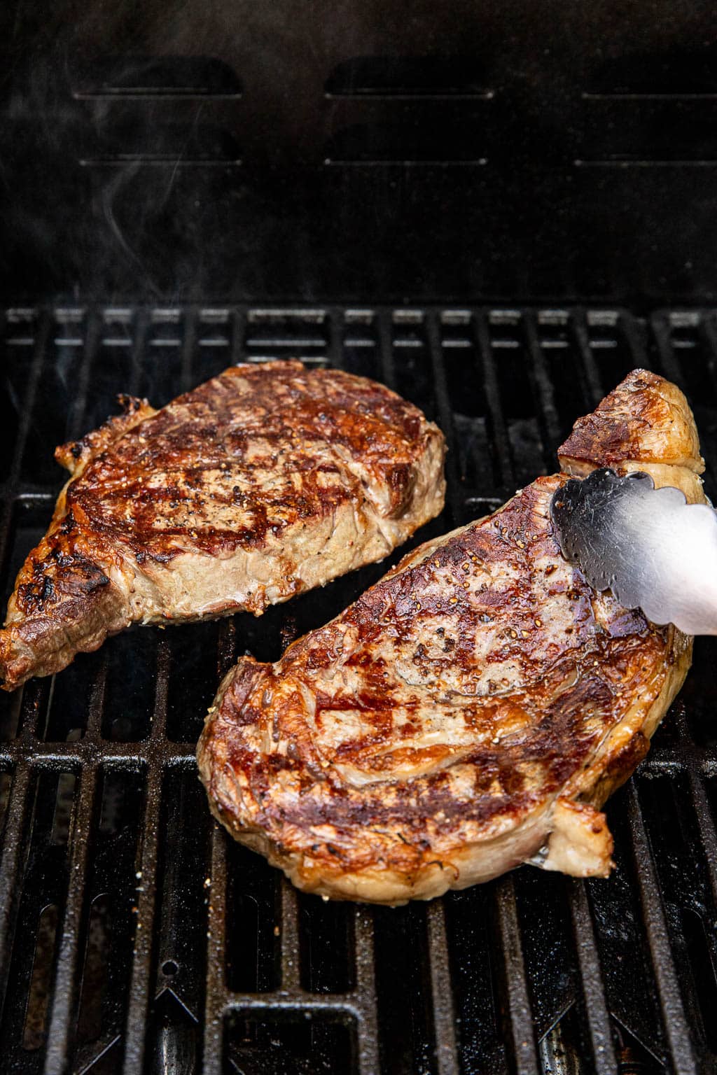 steaks on the grill after searing