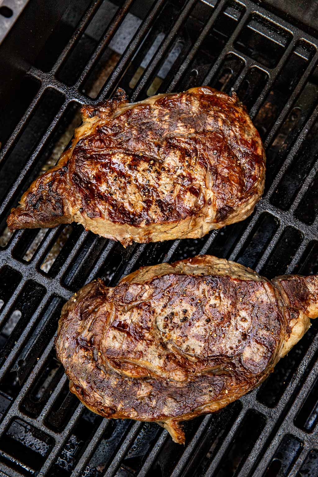 ribeye steaks on the grill