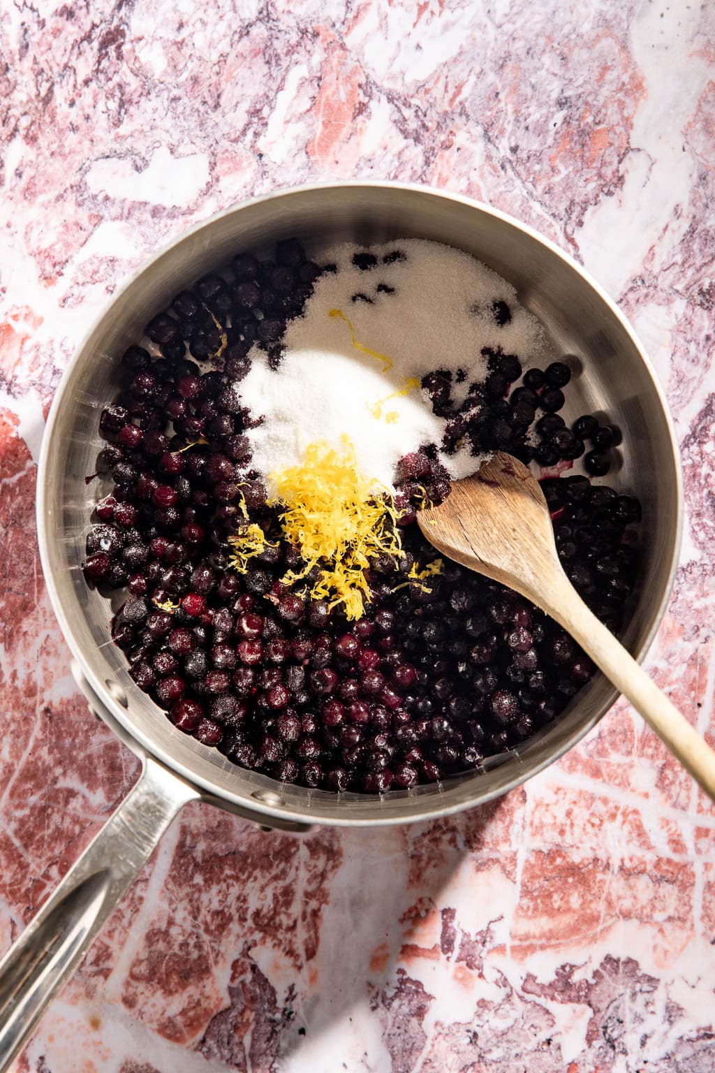 wild blueberry cheesecake ingredients in a saucepan before cooking