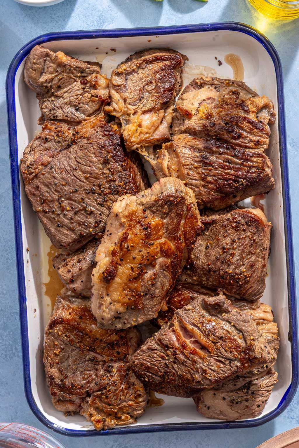 Beef pieces on a sheet tray after being seared