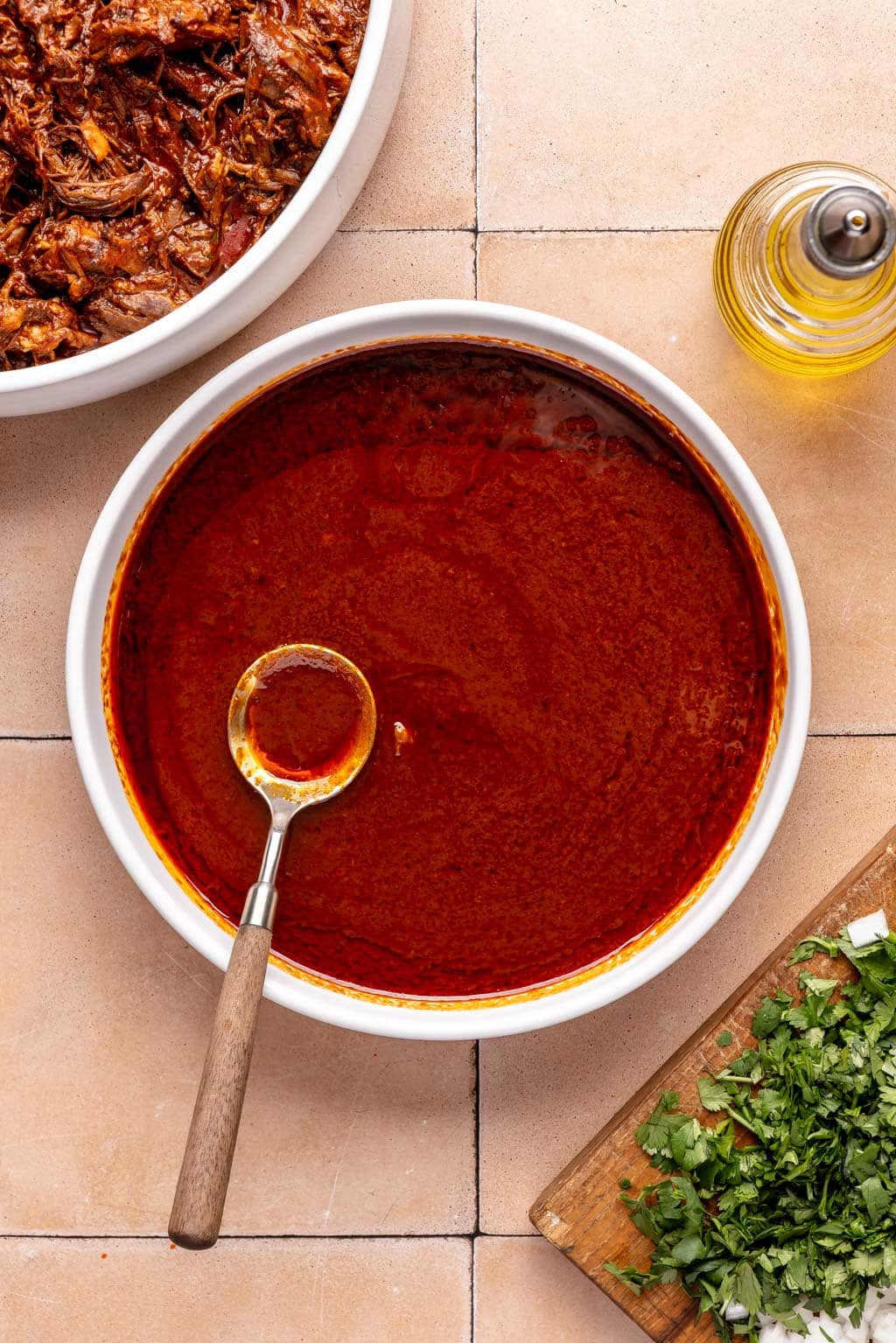 warmed birria braising liquid in a bowl