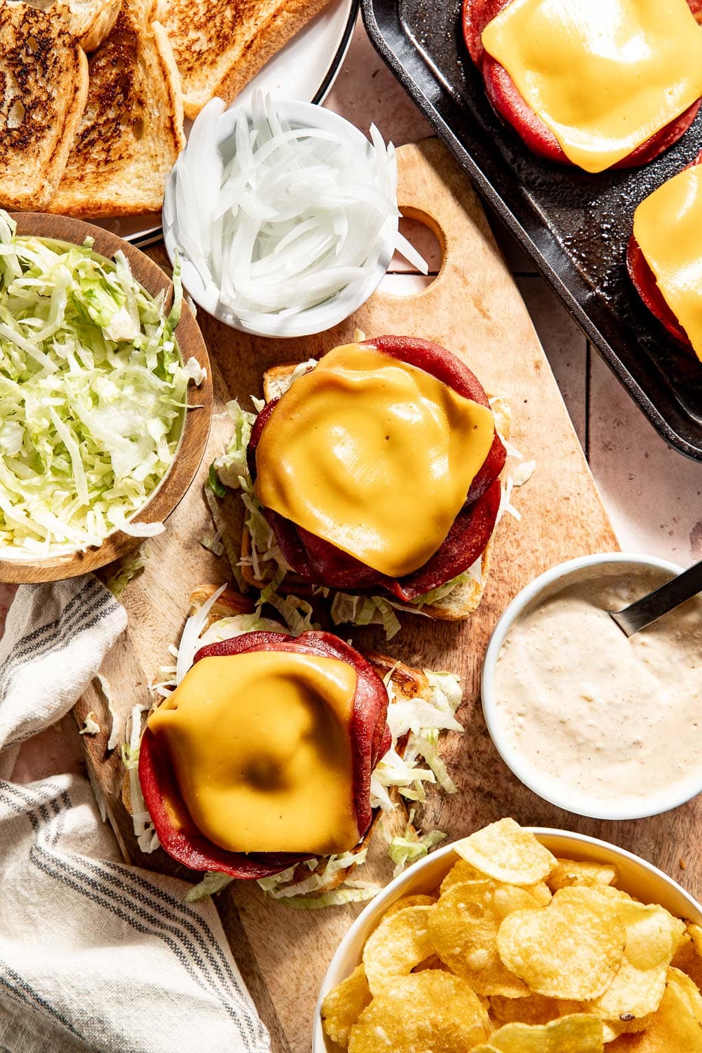 fried bologna sandwiches being assembled