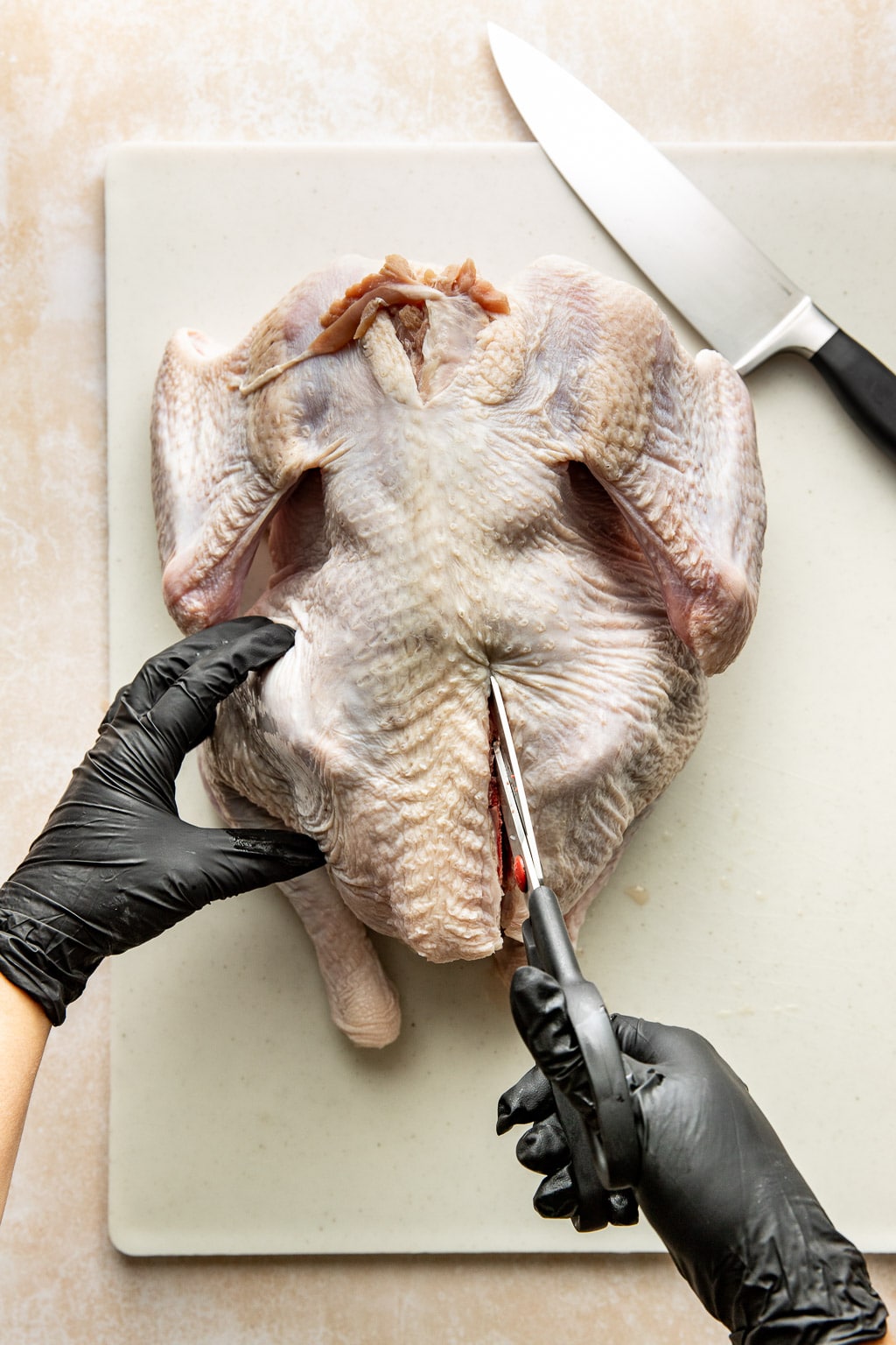 cutting the backbone out of a turkey 