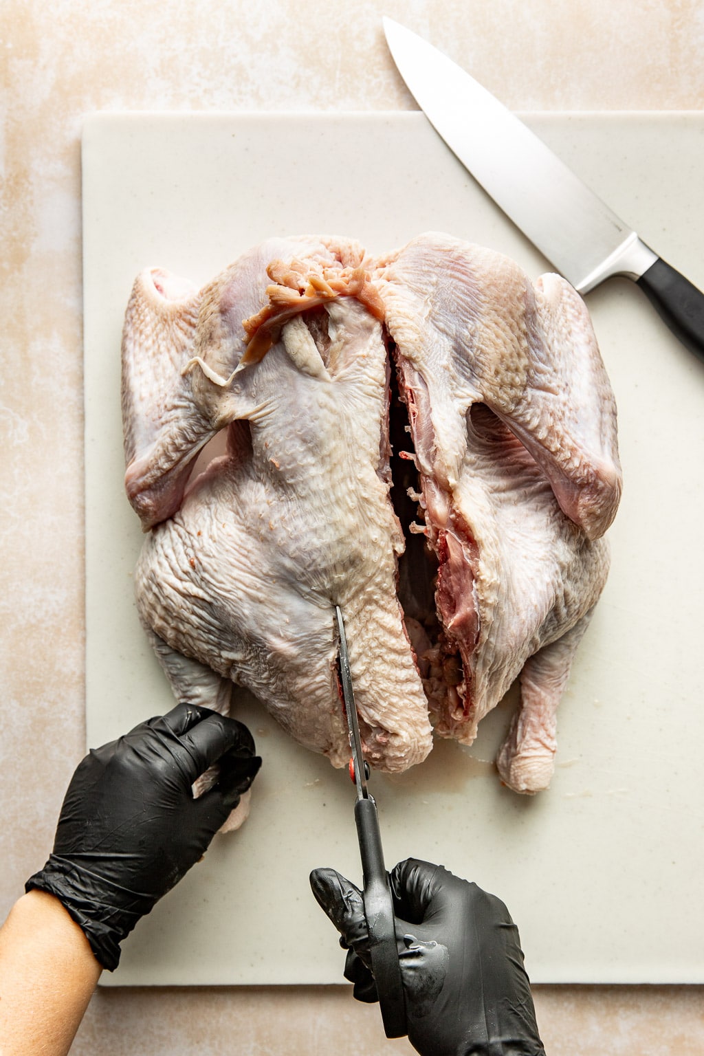 cutting the backbone out of a turkey 