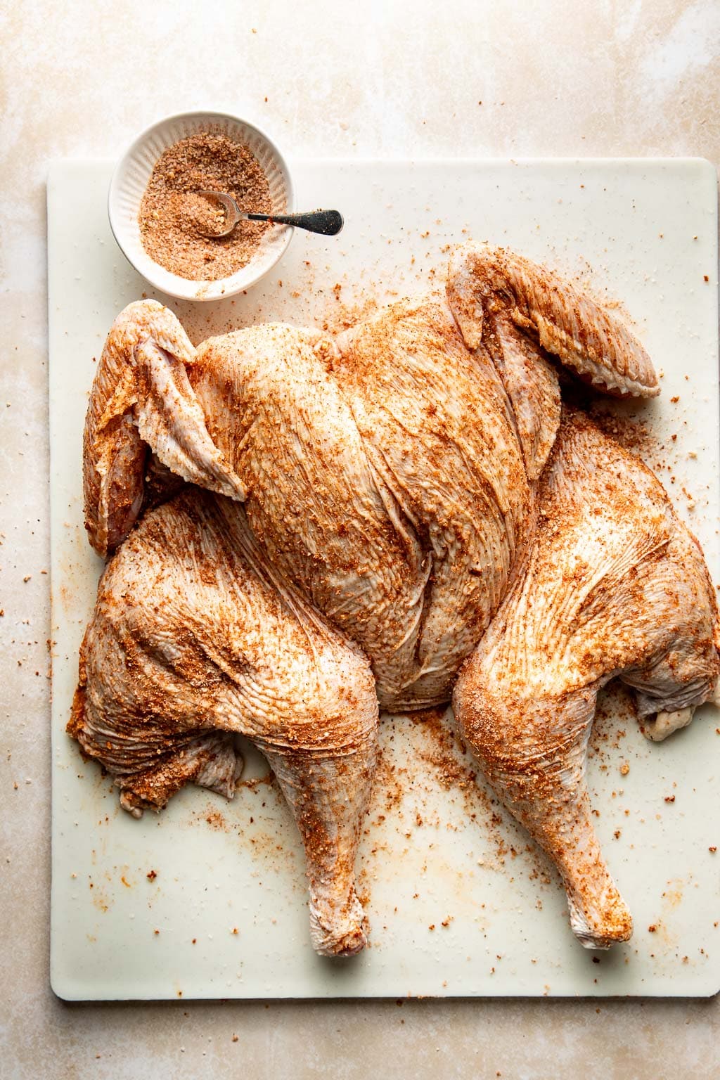 a spatchcocked turkey rubbed with dry brine 