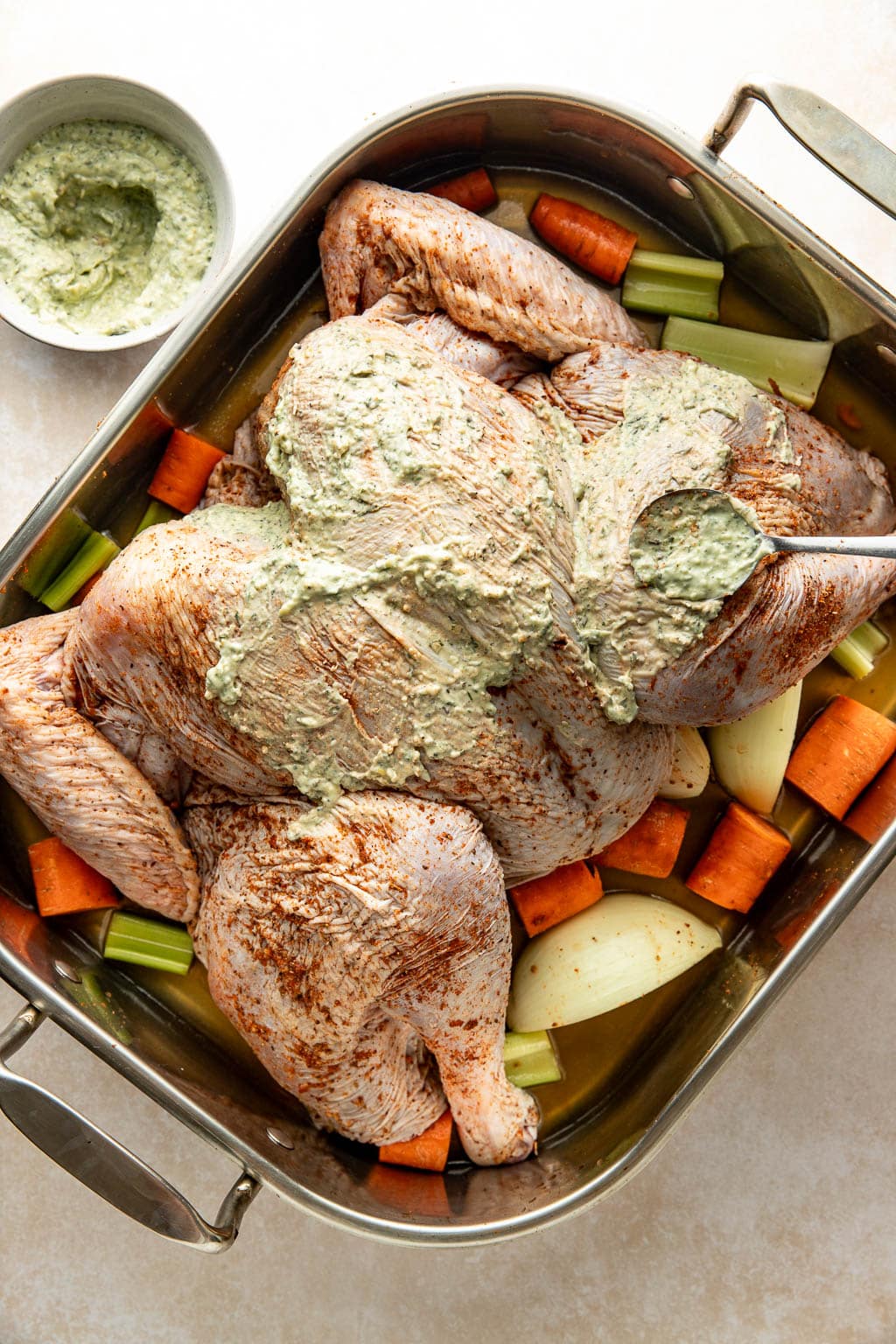 rubbing a turkey with herb mayonnaise 
