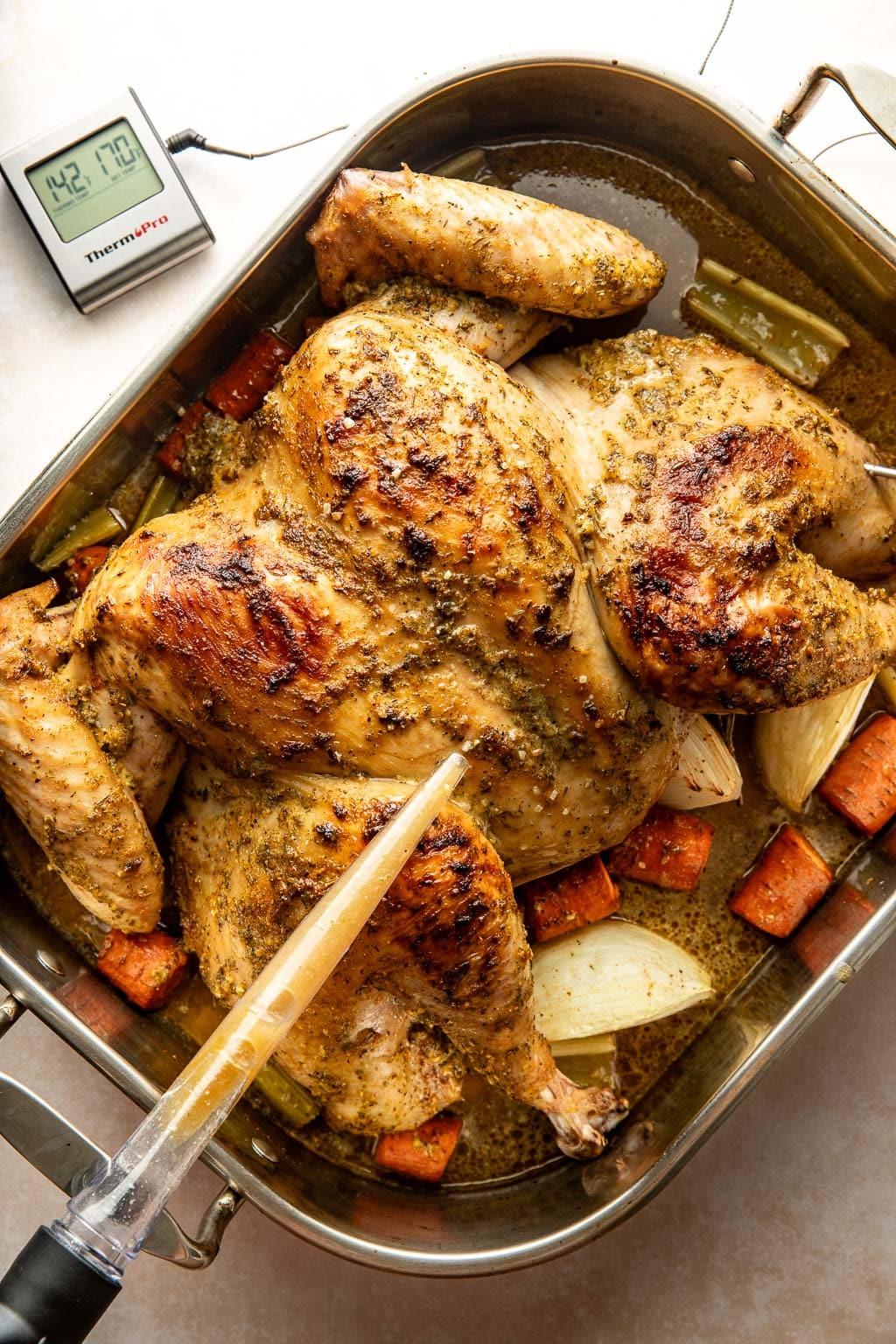 basting a turkey partway through cooking 