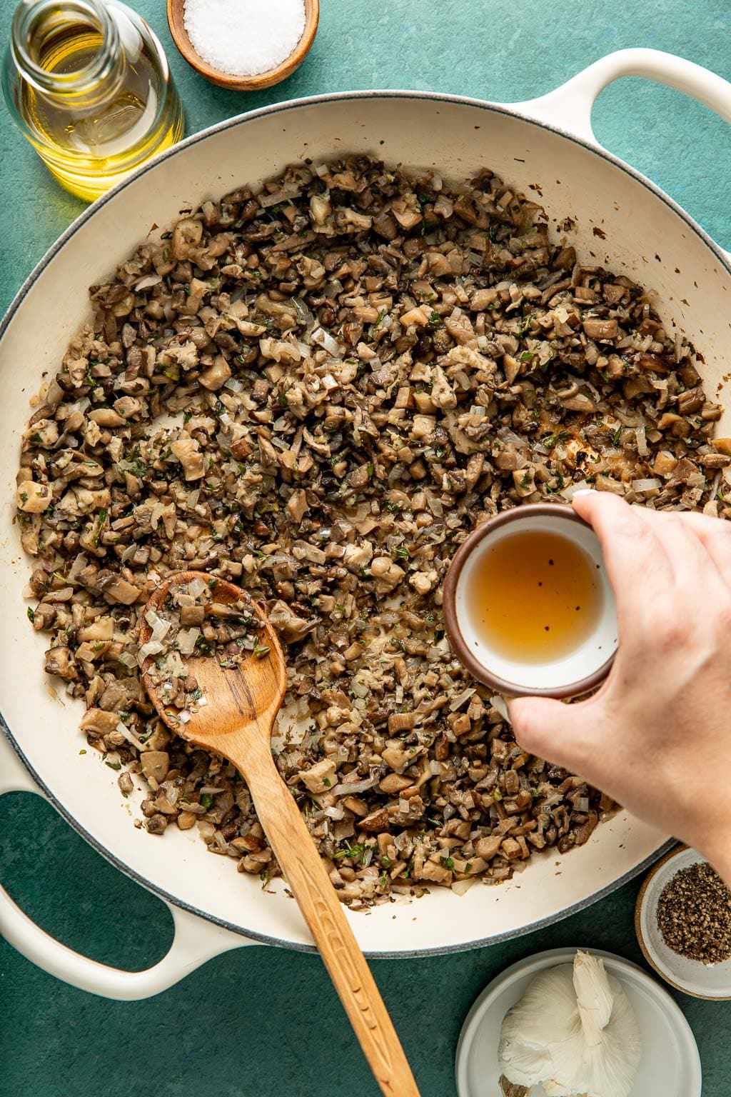 deglazing the mushrooms with madeira wine