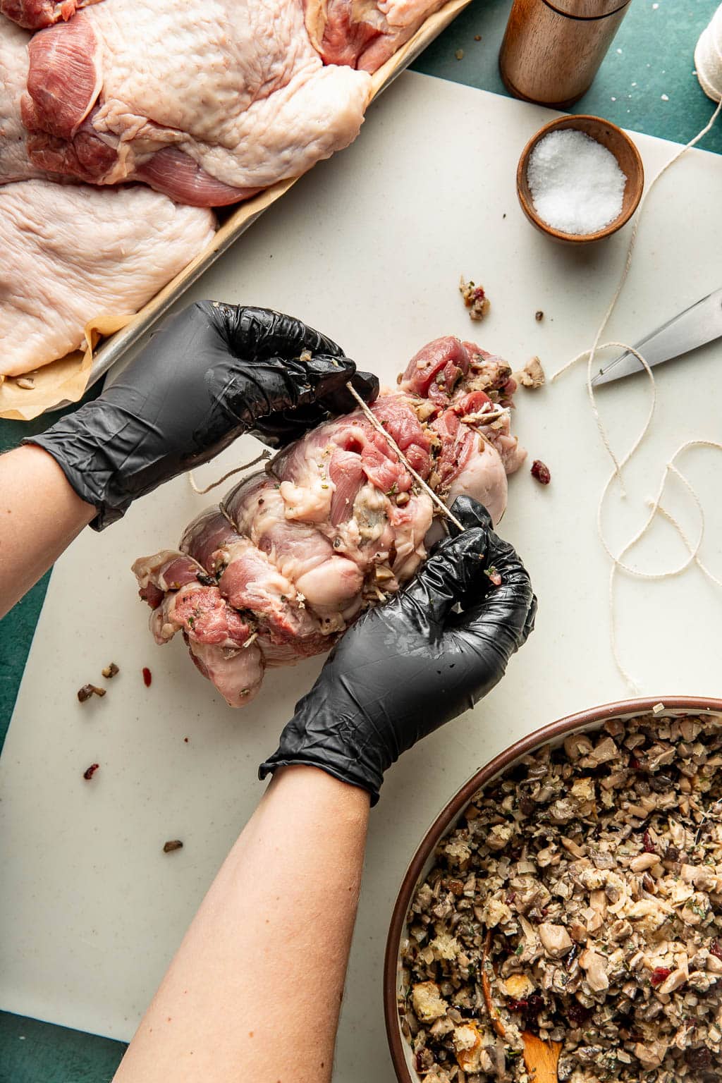 tying a stuffed turkey thigh with kitchen twine