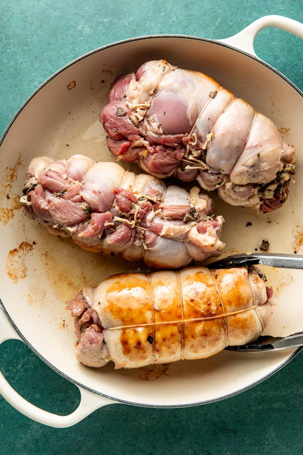 searing turkey thigh roulades in a braiser